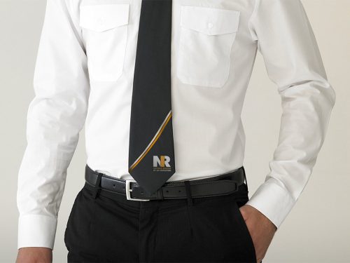 NRI Branded tie on person in white shirt